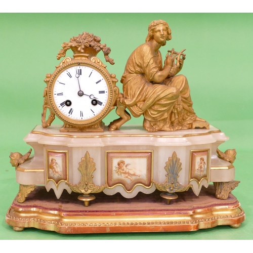 824 - J Marti, A 19th Century Gilt Metal and Onyx 8 Day Striking Drum Mantle Clock having a seated female ... 