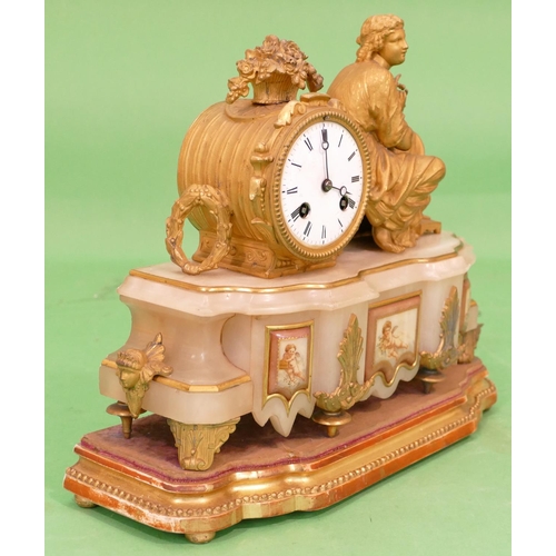 824 - J Marti, A 19th Century Gilt Metal and Onyx 8 Day Striking Drum Mantle Clock having a seated female ... 