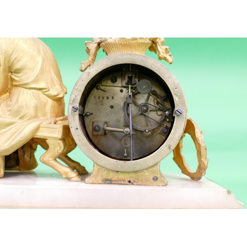 824 - J Marti, A 19th Century Gilt Metal and Onyx 8 Day Striking Drum Mantle Clock having a seated female ... 