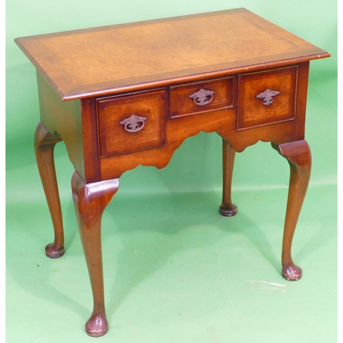 865 - A Reproduction Walnut Lowboy having banded herringbone top, centre drawer above knee hole flanked by... 