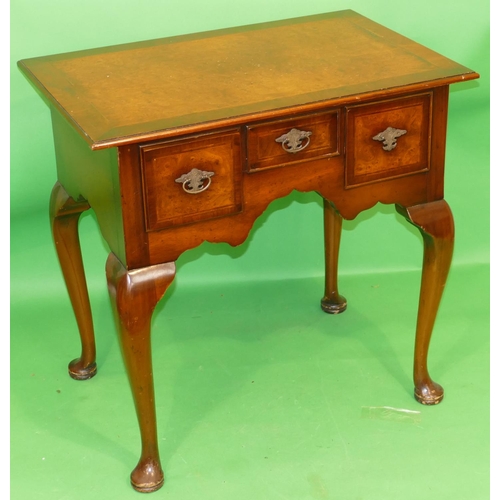 865 - A Reproduction Walnut Lowboy having banded herringbone top, centre drawer above knee hole flanked by... 