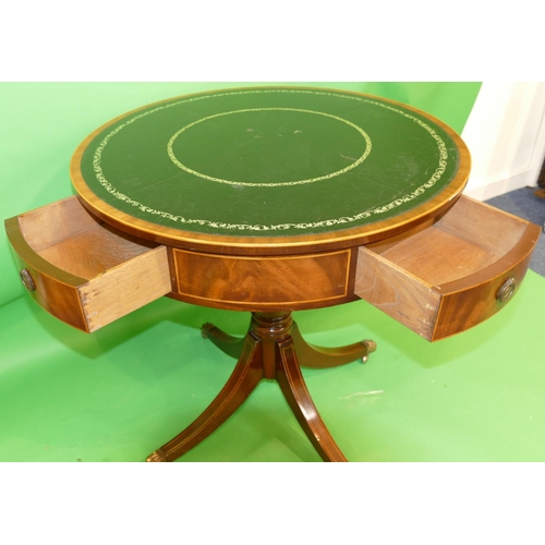 868 - A Mahogany Round Drum Occasional Table having revolving top with black leather inset, inlaid stringi... 