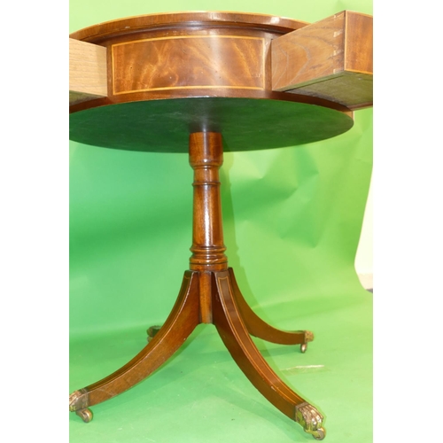 868 - A Mahogany Round Drum Occasional Table having revolving top with black leather inset, inlaid stringi... 