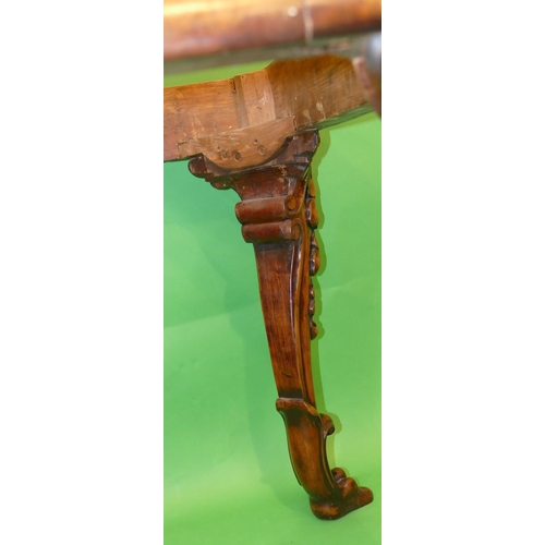 876 - A 19th Century Carved Walnut Centre Table having green marble top, on 4 cabriole legs with raised ca... 