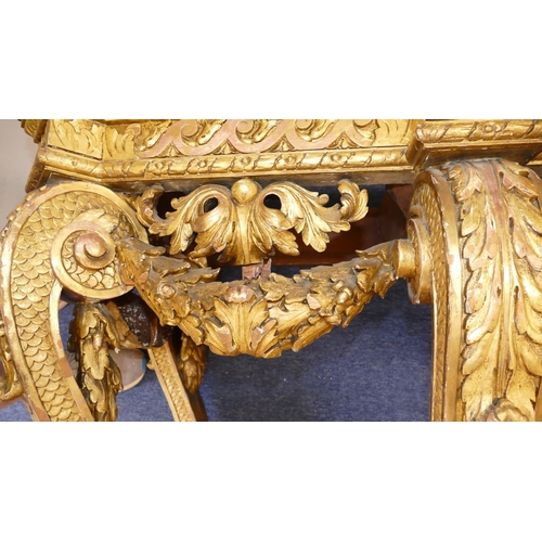 881 - An 18th Century & Later Carved Gilt Wood Console Table having green speckled marble top, carved frie... 