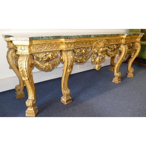 881 - An 18th Century & Later Carved Gilt Wood Console Table having green speckled marble top, carved frie... 