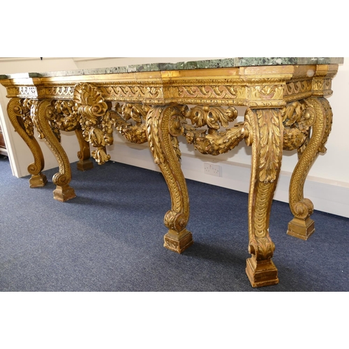 881 - An 18th Century & Later Carved Gilt Wood Console Table having green speckled marble top, carved frie... 