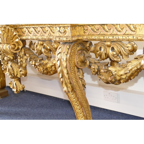 881 - An 18th Century & Later Carved Gilt Wood Console Table having green speckled marble top, carved frie... 