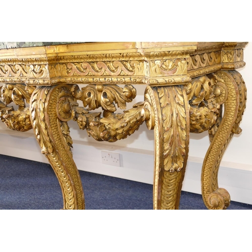 881 - An 18th Century & Later Carved Gilt Wood Console Table having green speckled marble top, carved frie... 