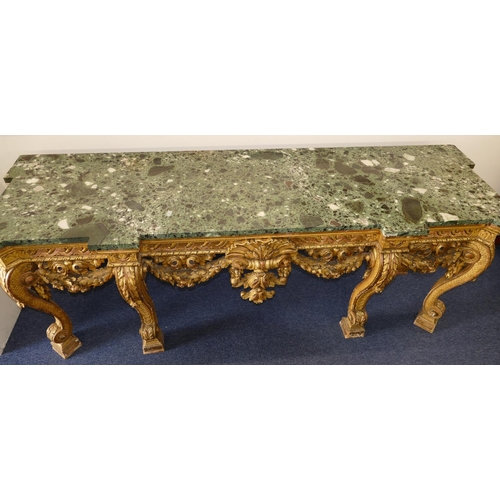 881 - An 18th Century & Later Carved Gilt Wood Console Table having green speckled marble top, carved frie... 