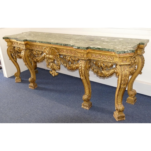 881 - An 18th Century & Later Carved Gilt Wood Console Table having green speckled marble top, carved frie... 