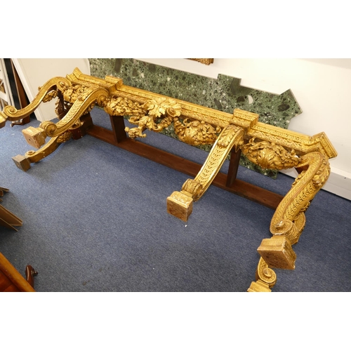 881 - An 18th Century & Later Carved Gilt Wood Console Table having green speckled marble top, carved frie... 