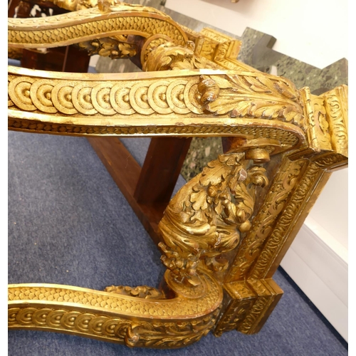 881 - An 18th Century & Later Carved Gilt Wood Console Table having green speckled marble top, carved frie... 