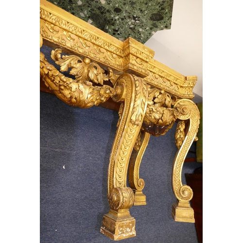 881 - An 18th Century & Later Carved Gilt Wood Console Table having green speckled marble top, carved frie... 