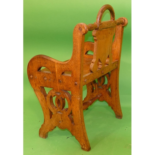 886 - A 19th Century Oak Hall Chair having shield back, solid seat on pierced splat end supports, centre t... 