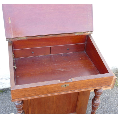 888 - A 19th Century Walnut Davenport having hinge top enclosing stationery box, sloping leather inset fro... 