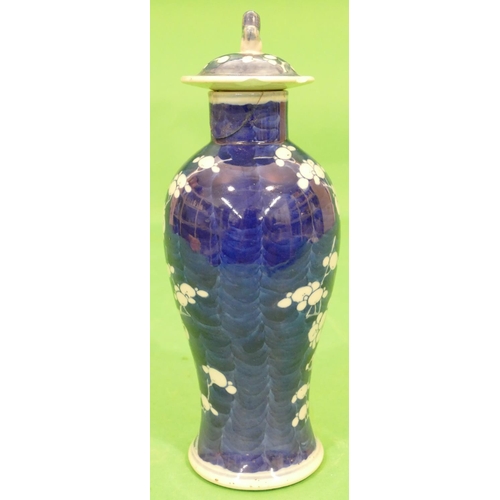 97 - A 19th Century Oriental Round Bulbous Thin Necked Lidded Vase on blue and white ground having branch... 