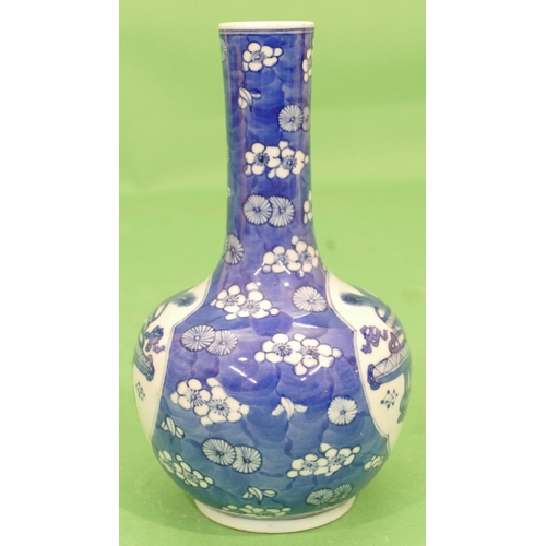 98 - An Oriental Round Bulbous Thin Necked Vase on blue and white ground having vase, floral and leaf dec... 