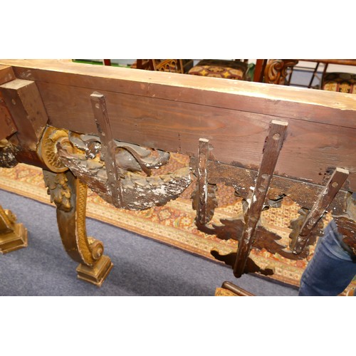 881 - An 18th Century & Later Carved Gilt Wood Console Table having green speckled marble top, carved frie... 