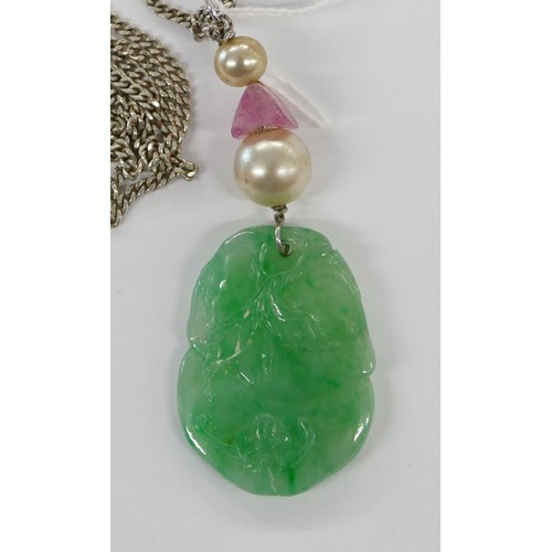 443 - A Jade Drop Pendant having carved leaf decoration mounted on silver chain.