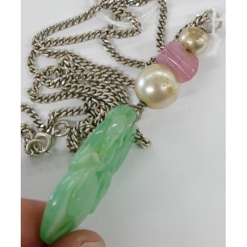 443 - A Jade Drop Pendant having carved leaf decoration mounted on silver chain.