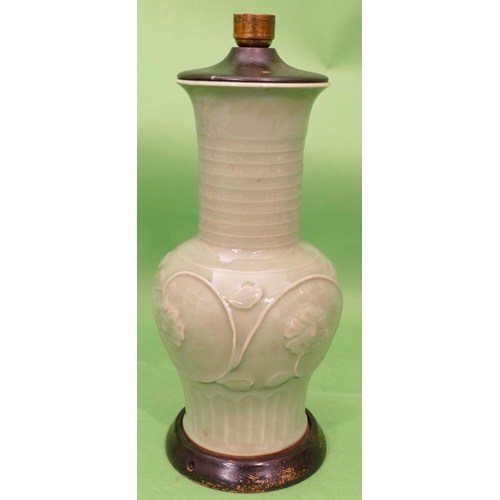 32 - An Oriental Celadon Round Bulbous Thin Necked Trumpet Shaped Table Lamp having raised floral and lea... 