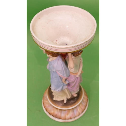 41 - A China Stand in form of 3 graces, on round sweeping base, 30.5cm high (missing bowl to top).