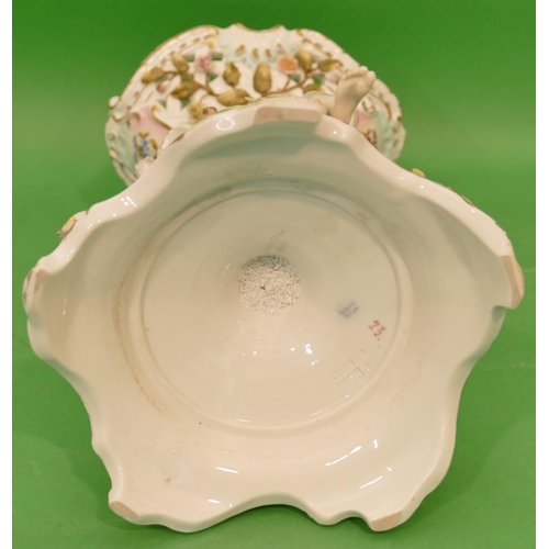 43 - A Continental China Oval Comport having raised cupid motif with all over encrusted floral and leaf d... 