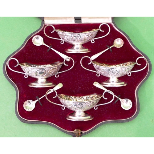 433 - A Set of 4 Chester Silver Oval Handled Salts, matching spoons having all over embossed decoration, s... 