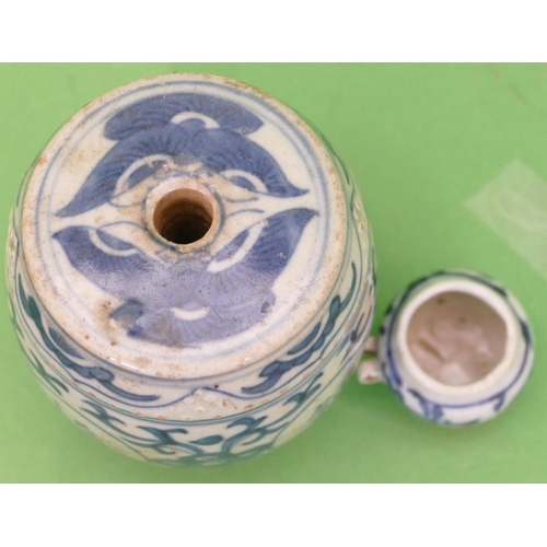 58 - An Oriental Blue and White Round Bulbous Shaped Quill Holder having all over floral and scroll decor... 