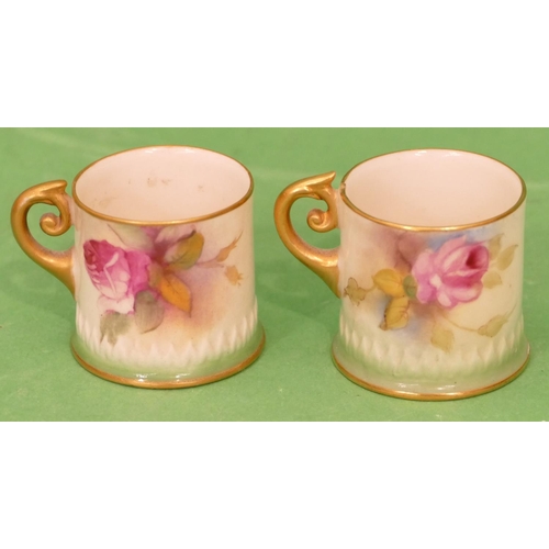 76 - 2 x Royal Worcester Miniature Mugs having multicoloured rose and leaf decoration, 4cm high.