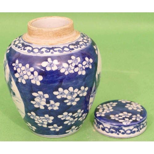 82 - An Oriental Round Bulbous Lidded Ginger Jar on blue and white ground depicting figure and blossom de... 