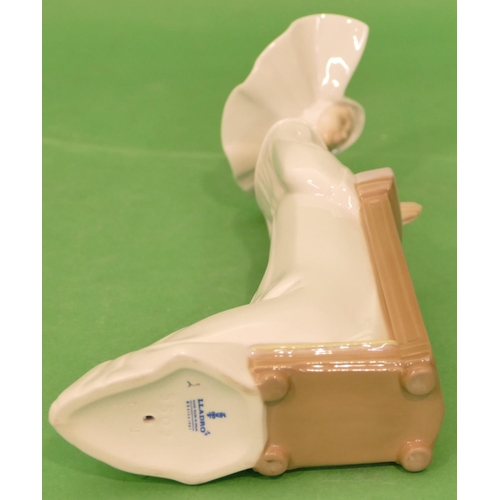 94 - A Lladro Figure of a kneeling nun, 22cm high.