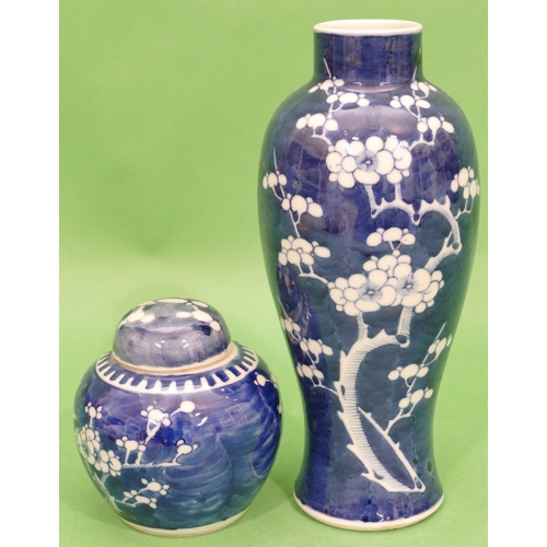 128 - A 19th Century Chinese Blue and White Round Bulbous Thin Necked Vase having blossom and branch decor... 