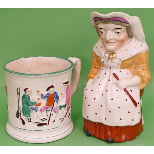 100 - A 19th Century Toby Jug in form of a seated lady, 24.5cm high, also a 19th century frog mug, having ... 