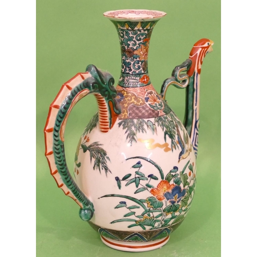 121 - An Oriental Round Bulbous Thin Necked Trumpet Shaped Coffee Pot on white ground with multicoloured, ... 