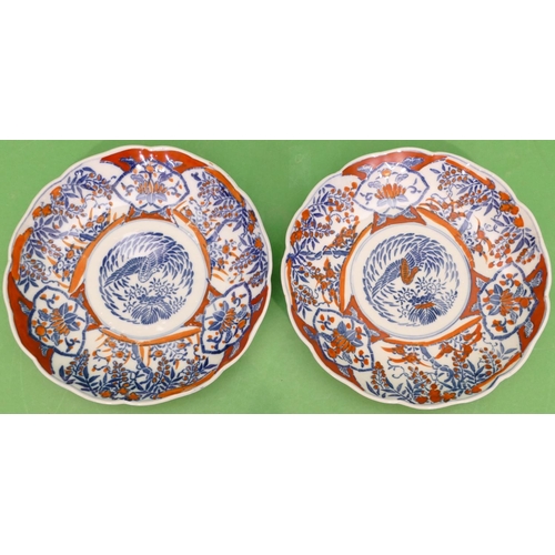 127 - A Pair of Imari Round Scallop Shaped Plates on white, red and blue ground with bird, floral and leaf... 