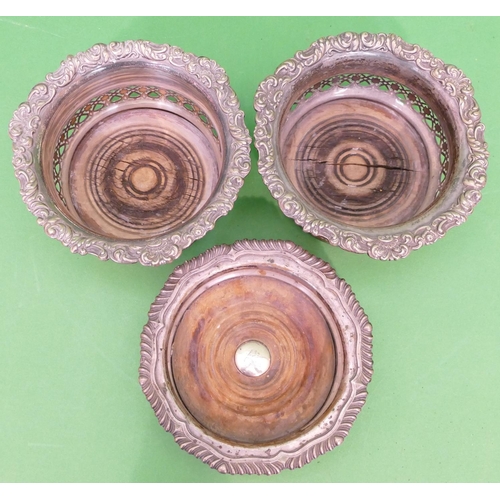 236 - A Pair of Silver Plated Trumpet Shaped Wine Coasters having raised floral and scroll rims, part pier... 