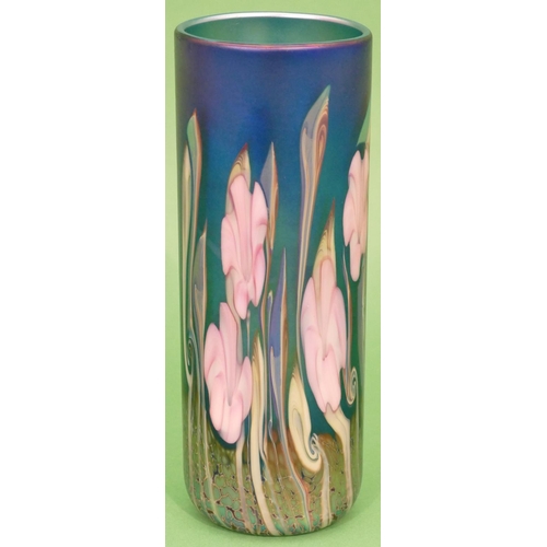 3 - An Okra Iridescent Glass Vase on blue ground with multicoloured floral and leaf decoration, signed R... 