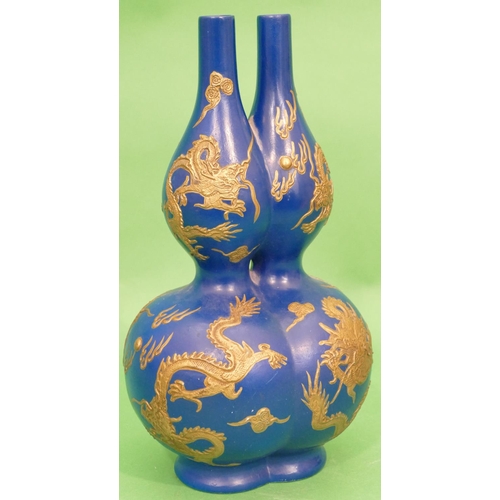 33 - An Oriental Bulbous Double Necked Vase on blue ground having raised gilt dragon decoration, 36cm hig... 