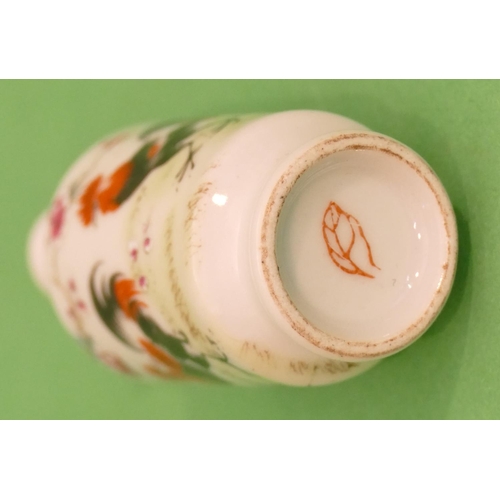 37 - An Oriental Round Bulbous Thin Necked Snuff Bottle with stopper on white ground with multicoloured b... 