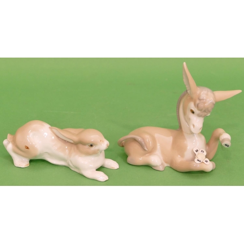 38 - A Lladro Figure of a donkey, 14cm long, also a Nao figure of a running rabbit (2).