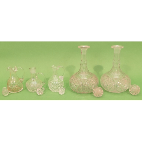 7 - A Pair of Glass Round Bulbous Thin Necked Decanters with stoppers, 30cm high, also 3 cut glass vineg... 