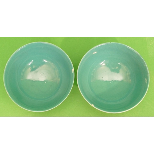 79 - A Pair of Oriental Round Trumpet Shaped Tea Bowls on white and green ground having multicoloured bir... 