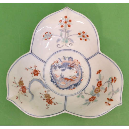 80 - An Oriental Leaf Shaped Dish on white and blue ground with coloured, floral, dragon and leaf decorat... 