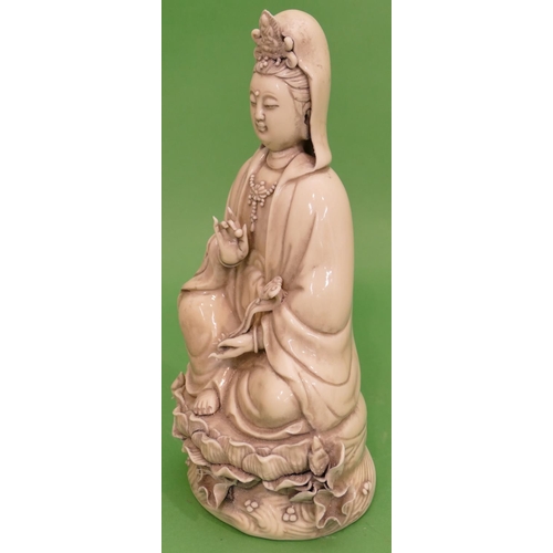 84 - An Oriental Blanc-De-Chine Figure of a seated goddess, 26.5cm high.