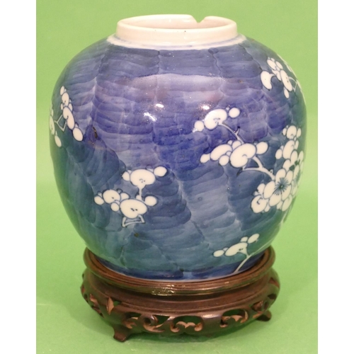 97 - A 19th Century Chinese Round Bulbous Ginger Jar on blue and white ground having blossom and branch d... 