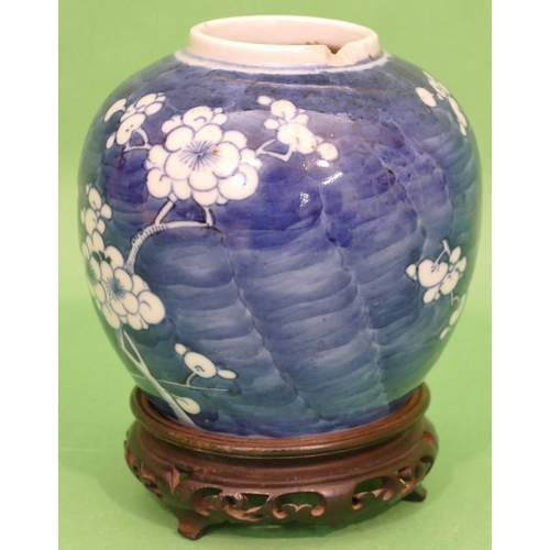 97 - A 19th Century Chinese Round Bulbous Ginger Jar on blue and white ground having blossom and branch d... 