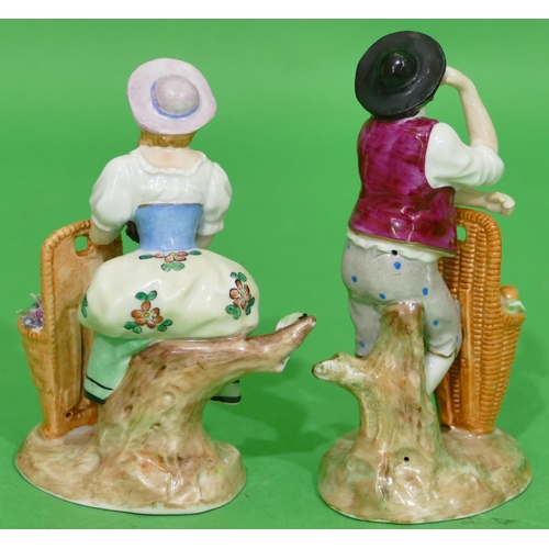 122 - A Pair of Sitzendorf Figures standing gentleman and lady with basket of fruit, 12cm high.