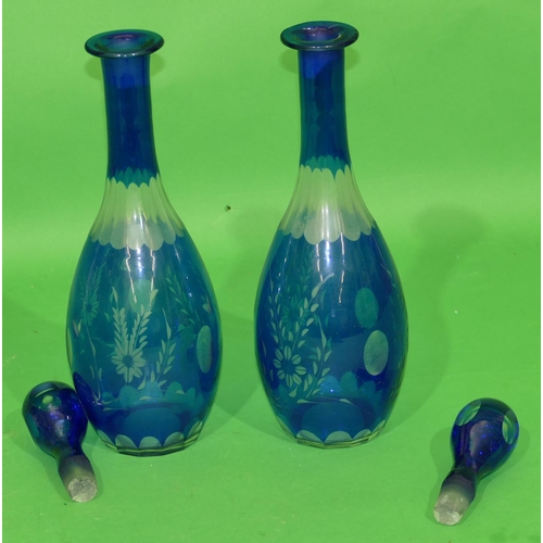 134 - A Pair of Blue and White Clear Glass Round Bulbous Thin Necked Decanters with stoppers having engrav... 